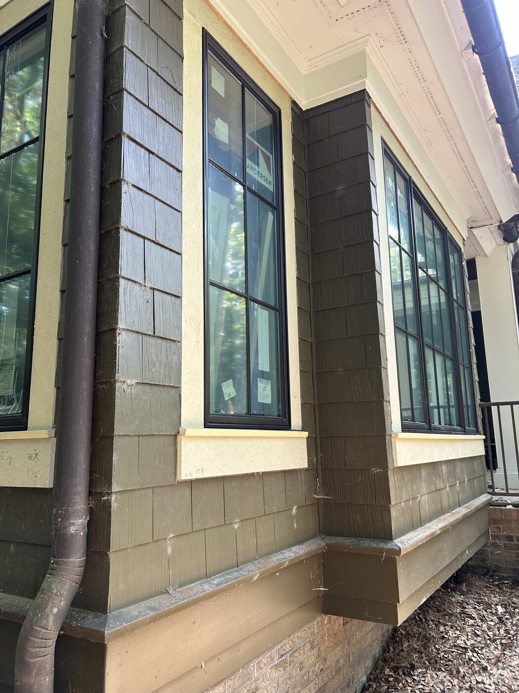 Cedar-shake exterior with black windows