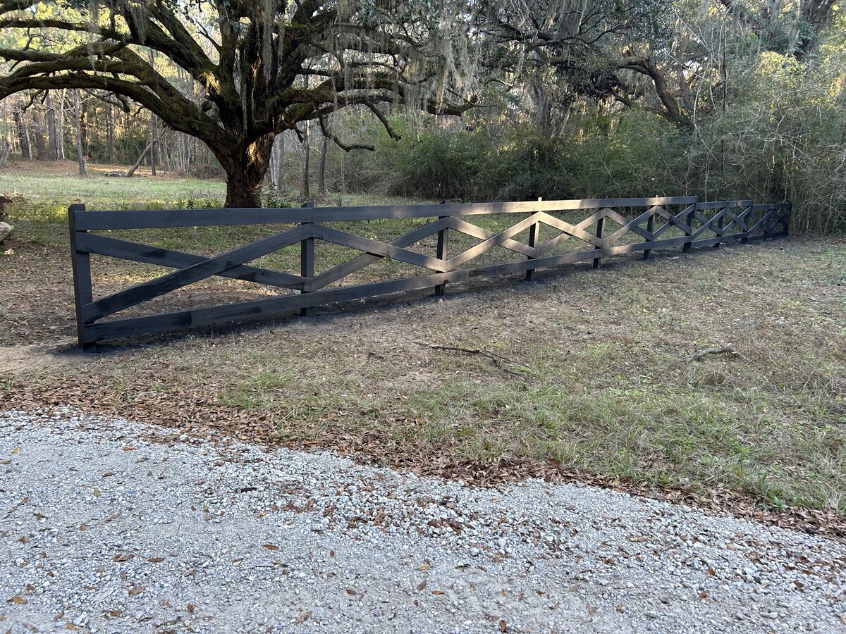 Custom-built ranch fence, stained black
